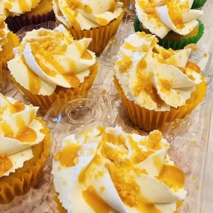 Set of 12 mini cupcakes with colored liners.