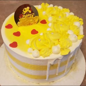Cardamom sponge cake with saffron milk, rasmalai, nuts, and rose petals.