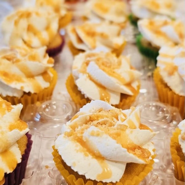 Set of 12 mini cupcakes with colored liners.