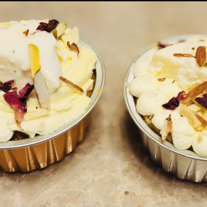 Eggless large fusion cupcakes with Indian flavors and nut toppings.