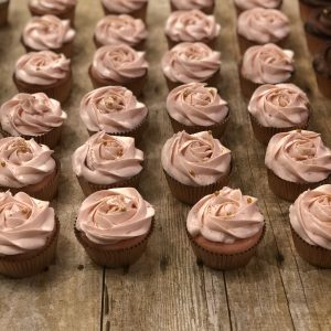 Delightful mini cupcakes with swirled frosting in various flavors.