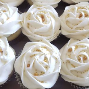 Delightful mini cupcakes with swirled frosting in various flavors.