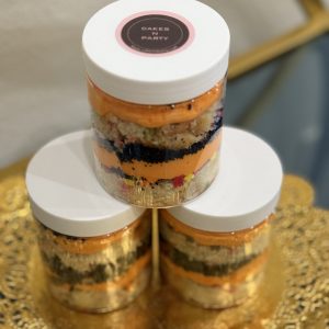 Dozen 8oz cake jars with layered moist cake, creamy frosting, and decadent fillings.