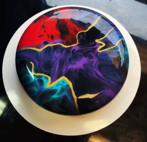 Galaxy mousse cake by V Galaxy-inspired mousse cake with vibrant colors and gold accents