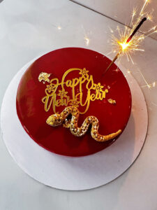 Snake New Year cake by V Year of the Snake chocolate cake with sparkler