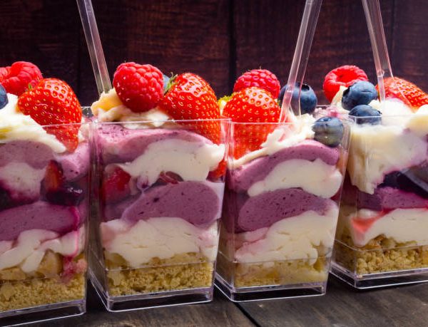Refreshing dessert: frozen berries sorbet with fresh berries, jam, ice cream, health snack